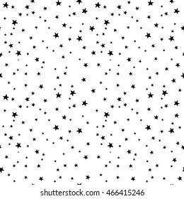 Seamless vector pattern with black and white stars of various sizes on white background. Childish background for postcards, wallpaper, papers, textiles, bed linen, tissue 1.2