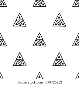 Seamless vector pattern. Black and white geometrical background with hand drawn decorative tribal elements. Print with ethnic, folk, traditional motifs. Graphic vector illustration.