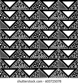 Seamless vector pattern. Black and white geometrical background with hand drawn decorative tribal elements. Print with ethnic, folk, traditional motifs. Graphic vector illustration.