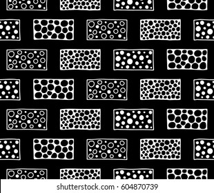 Seamless vector pattern. Black and white geometrical background with hand drawn decorative tribal elements. Print with ethnic, folk, traditional motifs. Graphic vector illustration.