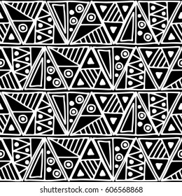 Seamless vector pattern. Black and white geometrical background with hand drawn decorative tribal elements. Print with ethnic, folk, traditional motifs. Graphic vector illustration.