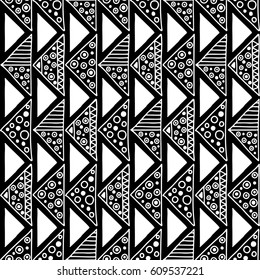 Seamless vector pattern. Black and white geometrical background with hand drawn decorative tribal elements. Print with ethnic, folk, traditional motifs. Graphic vector illustration.