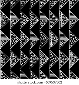 Seamless vector pattern. Black and white geometrical background with hand drawn decorative tribal elements. Print with ethnic, folk, traditional motifs. Graphic vector illustration.