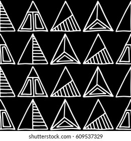 Seamless vector pattern. Black and white geometrical background with hand drawn decorative tribal elements. Print with ethnic, folk, traditional motifs. Graphic vector illustration.
