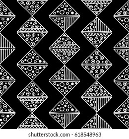 Seamless vector pattern. Black and white geometrical background with hand drawn decorative tribal elements. Print with ethnic, folk, traditional motifs. Graphic vector illustration