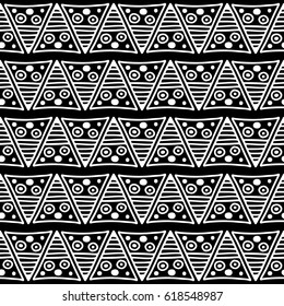 Seamless vector pattern. Black and white geometrical background with hand drawn decorative tribal elements. Print with ethnic, folk, traditional motifs. Graphic vector illustration