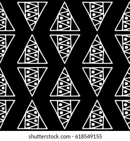 Seamless vector pattern. Black and white geometrical background with hand drawn decorative tribal elements. Print with ethnic, folk, traditional motifs. Graphic vector illustration