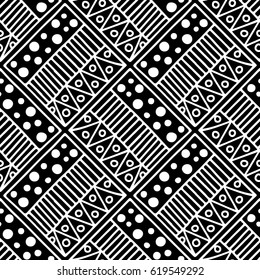 Seamless vector pattern. Black and white geometrical background with hand drawn decorative tribal elements. Print with ethnic, folk, traditional motifs. Graphic vector illustration.