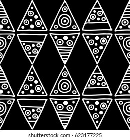 Seamless vector pattern. Black and white geometrical background with hand drawn decorative tribal elements. Print with ethnic, folk, traditional motifs. Graphic vector illustration.