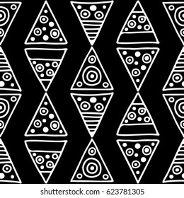 Seamless vector pattern. Black and white geometrical background with hand drawn decorative tribal elements. Print with ethnic, folk, traditional motifs. Graphic vector illustration.