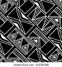 Seamless vector pattern. Black and white geometrical background with hand drawn decorative tribal elements. Print with ethnic, folk, traditional motifs. Graphic vector illustration.