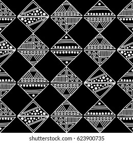 Seamless vector pattern. Black and white geometrical background with hand drawn decorative tribal elements. Print with ethnic, folk, traditional motifs. Graphic vector illustration.