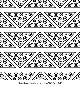 Seamless vector pattern. Black and white geometrical background with hand drawn decorative tribal elements. Print with ethnic, folk, traditional motifs. Graphic vector illustration.