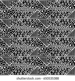 Seamless vector pattern. Black and white geometrical background with hand drawn decorative tribal elements. Print with ethnic, folk, traditional motifs. Graphic vector illustration.
