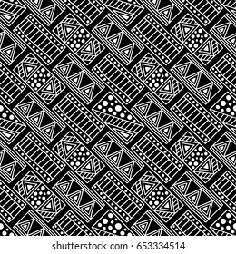 Seamless vector pattern. Black and white geometrical background with hand drawn decorative tribal elements. Print with ethnic, folk, traditional motifs. Graphic vector illustration.