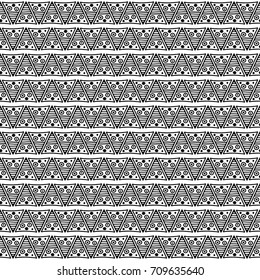Seamless vector pattern. Black and white geometrical background with hand drawn decorative tribal elements. Print with ethnic, folk, traditional motifs. Graphic vector illustration.