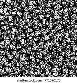 Seamless vector pattern with black and white three and four  clover leaves. Doodle hand drawn illustration. Adult coloring page zentangle.