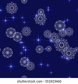 Seamless vector pattern. Blue abstract Christmas glittering background with snowflakes and stars.