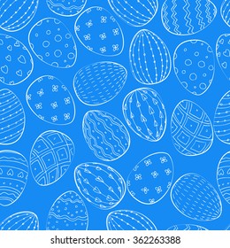 Seamless vector pattern. Vector blue background with Easter eggs. 