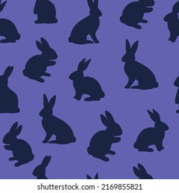 Seamless vector pattern with blue easter bunnies on purple background