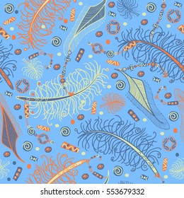 Seamless vector pattern in bohemian style with feathers, beads and chinese coins. Orange, tea green and dark turquoise on blue background.