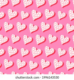 Seamless vector pattern with bright and funny pink hearts on a bright pink background. For wrapping paper, package design, textile, any backgrounds.