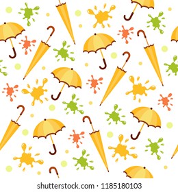 Seamless vector pattern with bright yellow umbrellas and spots. Cartoon background. Autumn mood. Rainy weather