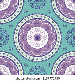 Seamless vector pattern of a brightly colored mandala. Great for teens, tweens, young women's fashion and fun.