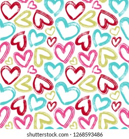 Seamless vector pattern with brush strokes hearts in bright colors.