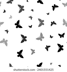 Seamless vector pattern with butterfly symbols, creating a creative monochrome background with rotated elements. Vector illustration on white background