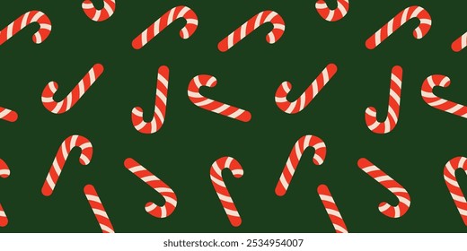 Seamless vector pattern with candy canes on a green background in a fun, flat cartoon style. Perfect for holiday designs, Christmas wrapping paper, festive decorations, and seasonal projects.