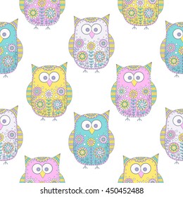 Seamless vector pattern with cartoon doodle owls. Cute birds with hand drawn floral ornament. Pastel color owls on white background. Nice design for kids.