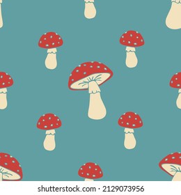 Seamless vector pattern with cartoon mushrooms on blue background. Simple hand drawn toadstool wallpaper design. Decorative autumn fashion textile.