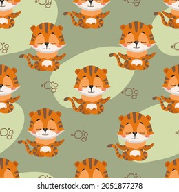 Seamless vector pattern with cartoon tiger cub meditating in lotus position. Image in fun flat style for print and digital use.