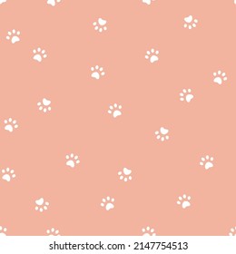 Seamless vector pattern with cat or dos paws prints on pink background.