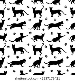 Seamless vector pattern with cats. Cats in different poses and paws. Pattern pets. Children's pattern with cats.