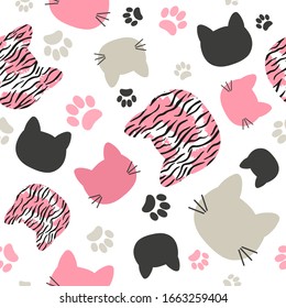 Seamless vector pattern with cats heads and tiger print for kids
