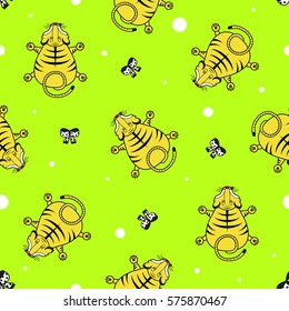 Seamless vector pattern for children. Tiger cub top view and bows on a bright green background