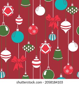 Seamless vector pattern with Christmas baubles on red background. Simple winter decoration wallpaper design. Festive fashion textile.