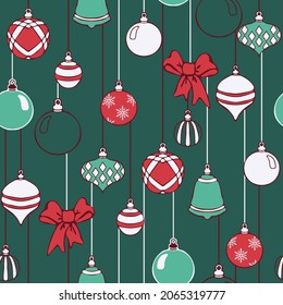 Seamless vector pattern with Christmas baubles on green background. Winter festive wallpaper design. Decorative celebration fashion textile.