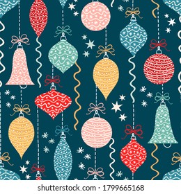 Seamless vector pattern with Christmas ornaments on a dark background. 