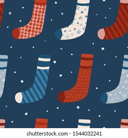 Seamless vector pattern with Christmas socks. Seamless pattern for cards, wrapping papers, posters. Creative hand drawn pattern for winter holidays. Seamless texture for Christmas design