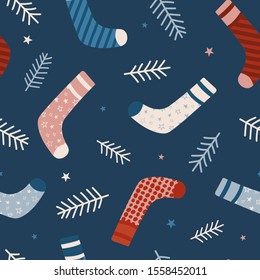 Seamless vector pattern with Christmas socks. Seamless pattern for cards, wrapping papers, posters. Creative hand drawn pattern for winter holidays. Seamless texture for Christmas design