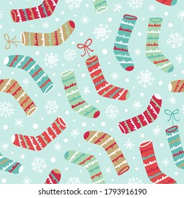 Seamless vector pattern with Christmas stocking and snowflakes.