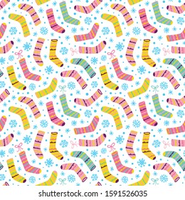 Seamless vector pattern with Christmas Stockings, snowflakes and snow.