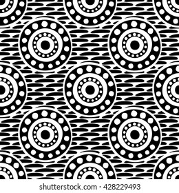 Seamless vector pattern with circles, dots and strokes. Black and white abstract background with drawn elements and ornamental symbols. Decorative repeating ornament. 