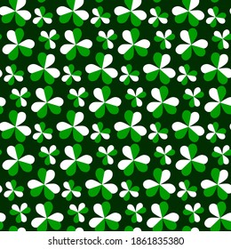 Patrón vectorial sin soldadura con hojas de trébol sobre fondo verde oscuro. Ilustración del Día de San Patricio con shamrock.