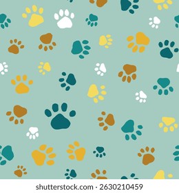 Seamless vector pattern with colorful animal paw prints on pastel green background for pet-related surfaces