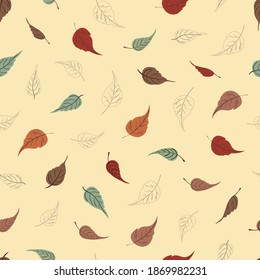 Seamless vector pattern with colorful autumn leaves on a beige background.