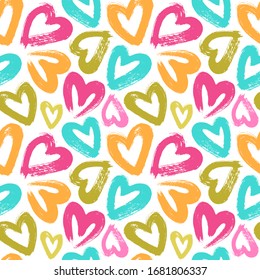 Seamless vector pattern with colorful brush strokes hearts.